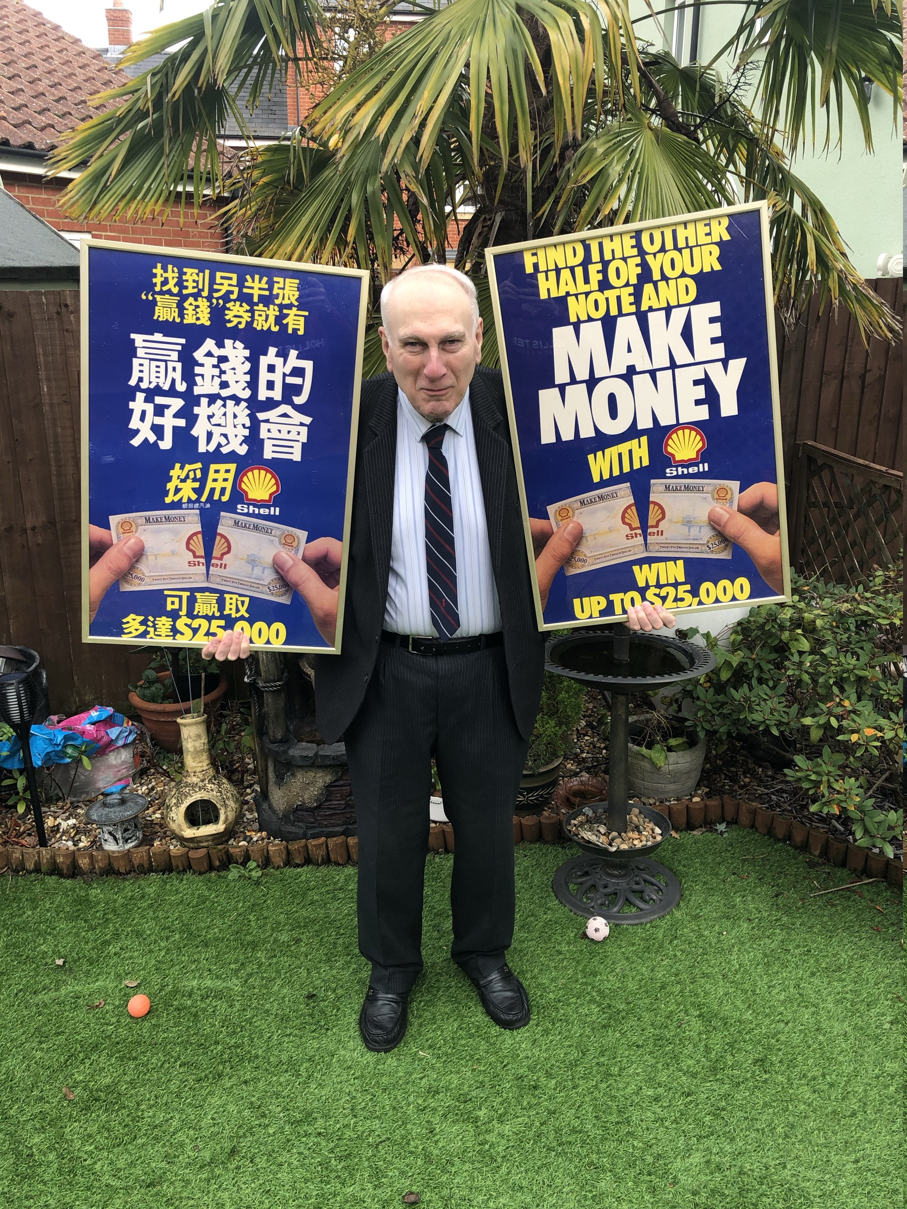 John Donovan holding Make Money posters in 2020
